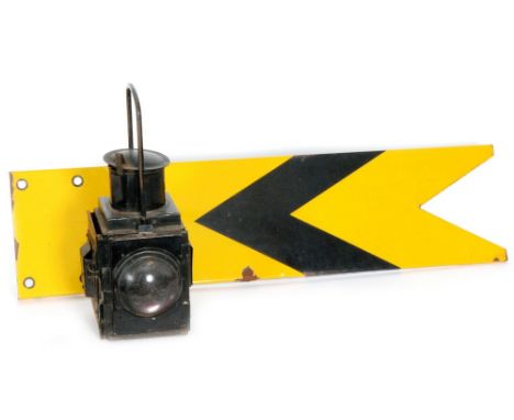 Three enamelled circular ground signal plates, a yellow distance signal arm and a signal lamp, unnamed, height 49cm (5)