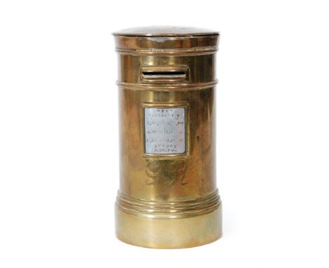 A First World War trench art model of a brass post office pillar box engraved GR and inset with an aluminium collection time 