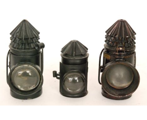 An early 20th Century black painted police hand lamp by Hiatt & Co Birmingham with conical cover and two similar examples. (3