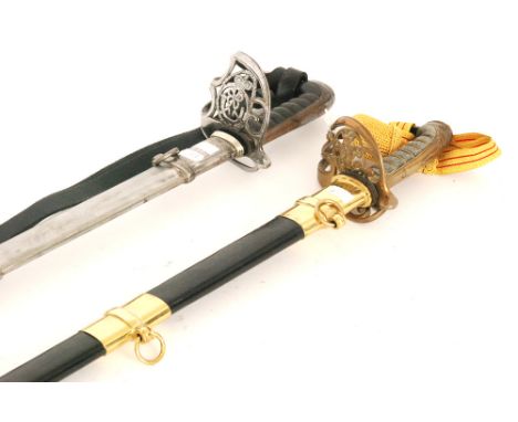 A George V artillery officer's sword and leather scabbard with pierced brass cypher to guard and ray skin handle, 81cm blade 