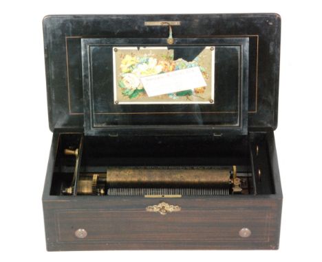 A musical box playing eight airs with tune card, cylinder 23.5cm in a marquetry rosewood inlaid case, width 46cm