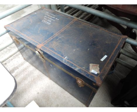 A vintage tin bound travel trunk