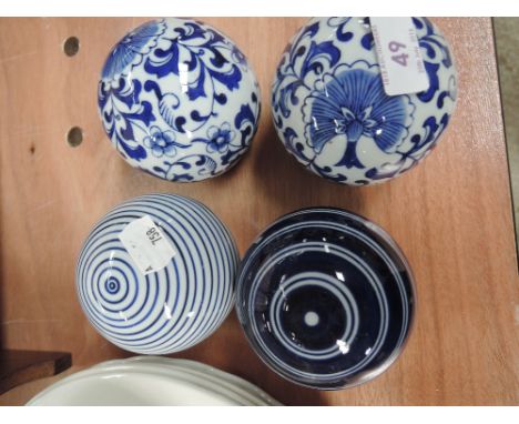 A set of 4 reproduction blue and white carpet bowls