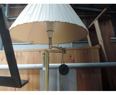 A modern brass standard lamp