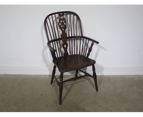 A 19th century elm and yew stick back open armchair with later restorations - Height 103cm