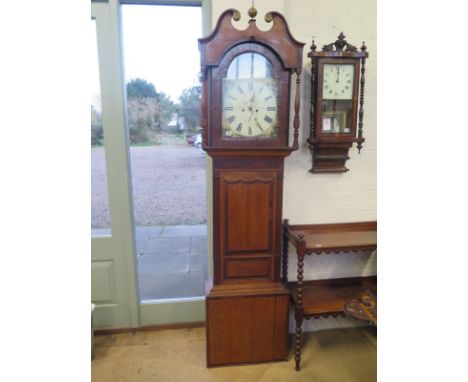 An 8 day oak and mahogany longcase clock with painted arched 14 inch dial signed Dold Inverness