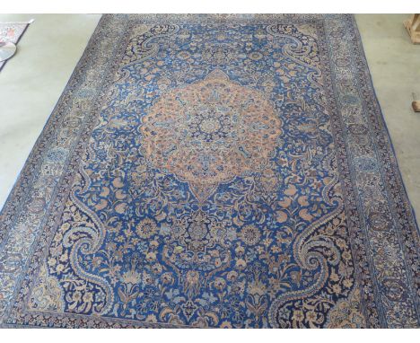 A fine old Persian Kerman hand knotted carpet with five blue design - 294cm x 410cm - with provenance from vendor