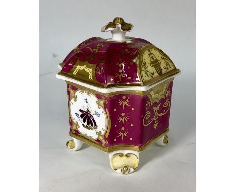 A 19th century French porcelain, probably Paris, square chamfered ink well and cover, raised on four scrolling feet, painted 