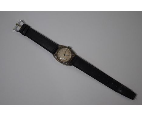 A vintage Rolex wristwatch with 21-jewel movement and silvered 22 mm dial, in engraved .900 grade case (c.1920s/30s), (later 