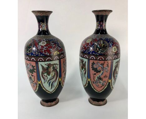 A pair of Chinese ovoid cloisonne vases, black ground decorated with panels of alternating dragons and phoenix, late 19th cen