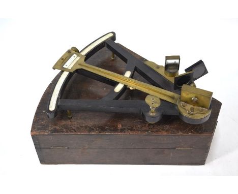 A 19th century ebony and brass octant with inset ivory scale and other mounts, 10 in radius, apparently unnamed, in original 