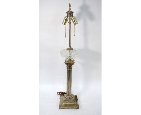 An electroplated classical column table lamp in the form of an oil lamp with a pressed glass reservoir, 88 cm high overall