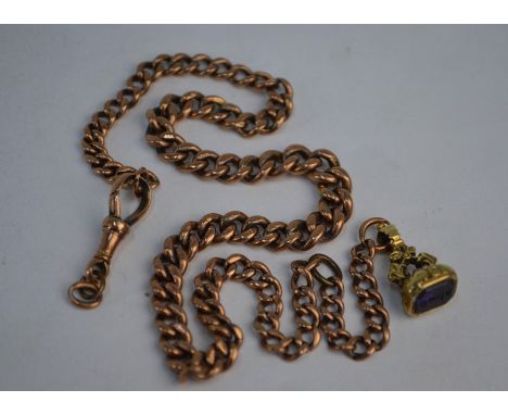 A 9ct gold curb-link watch chain with dog-clip, hung with a small 19th century unmarked yellow metal fob seal inset with amet