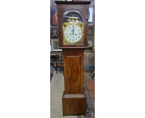 A 19th century feather-banded mahogany longcase clock, the 8-day movement with painted arched dial, later concealed by brass 