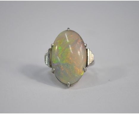 An oval opal ring in the Art Deco style, white metal set stamped 18ct plat, size K, 5.1g all in, opal 2 cm long [P19020640]Op