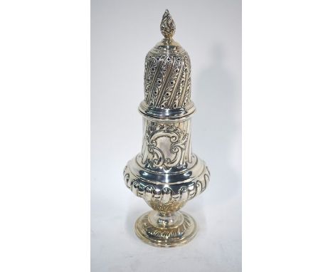 A late Victorian large silver baluster sugar caster with flame finial above writhen reeding and fluting and rococo scroll emb