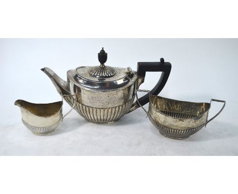 A silver three-piece bachelor tea service of oval half-reeded form, William Hutton &amp; Son Ltd., Sheffield 1924, 10.8 oz gr