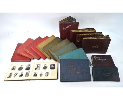 An extensive collection of cigarette cards in seventeen vintage albums, including Wills's, Players, Ogdens (including Austral