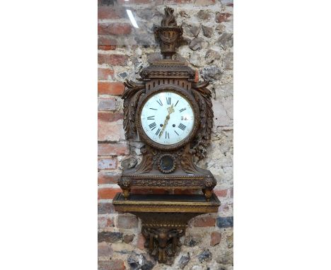 A large French carved (dull) giltwood bracket clock, 19th century, the twin train movement with star-burst pendulum striking 