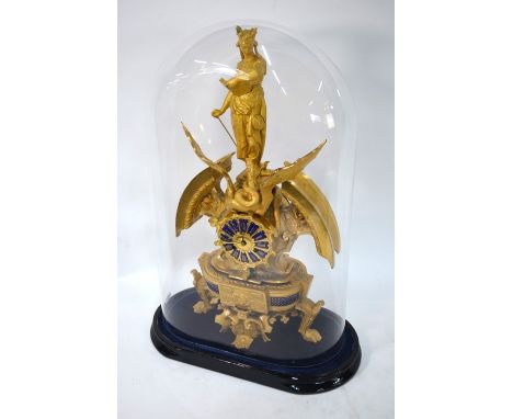 A French gilt mantel clock surmounted by an allegorical representation of St Margaret and the Dragon, the dial with blue enam