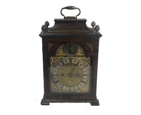 A Georgian mahogany cased twin fuse table or bracket clock, with verge escapement and engraved backplate, the arched dial wit