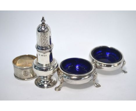A pair of early George III circular open salts with beaded rims and hoof feet, maker's mark obscured, London 1762, to/w a bal