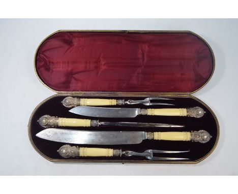 A Victorian cased five-piece carving set with silver-mounted carved ivory handles, Harrison Brothers &amp; Howson, Sheffield 