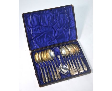 A Victorian cased set of twelve silver teaspoons with engraved strapwork-decorated stems, Josiah Williams &amp; Co., Exeter 1