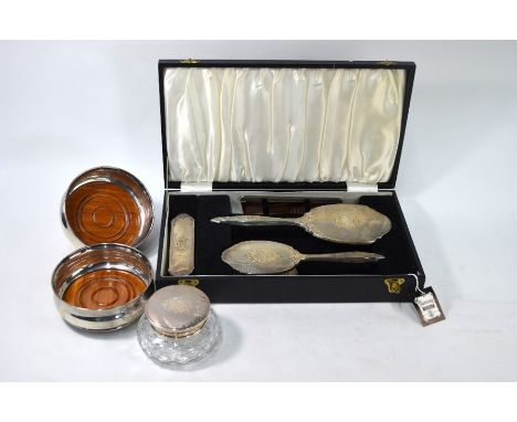 A cased silver four-piece brush set with engraved and engine-turned decoration, to/w the matching powder-bowl, Jubilee marked