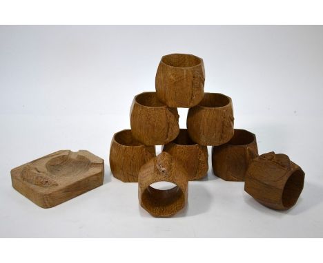 Thompson 'Mouseman' of Kilburn: a set of eight octagonal oak napkin rings, carved with traditional mouse motif, 5.5 cm diam t