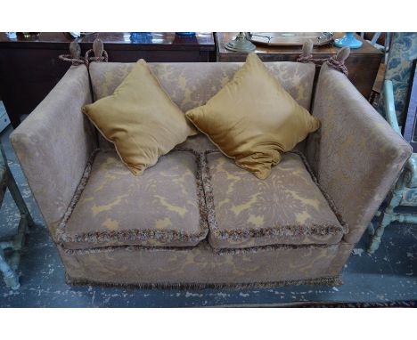 A traditional two seat Knole style sofa, serviceable but for re-upholstery, 155 cm wide