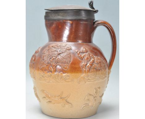 Vauxhall Pottery - An early 19th Century London Salt Glazed Stoneware ewer jug . The two tone jug of bulbous form featuring r