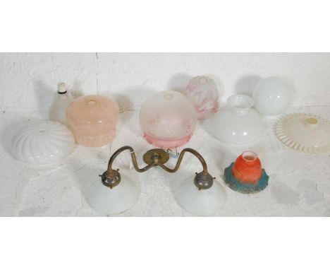 A good group of vintage glass shades dating from the early 20th Century to include Art Deco examples with a white swirl shade