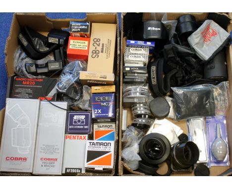 A quantity of camera accessories including flashes, hoods, filters, camera and lens cases etc. for Pentax, Nikon etc. (2 boxe