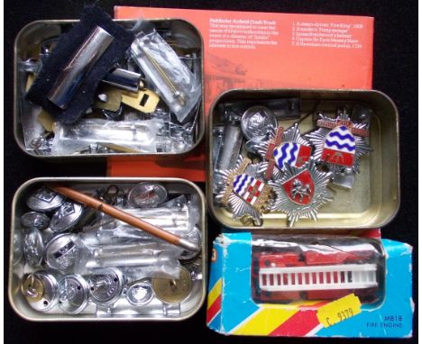 Fire Brigade. Three London, one Kent, cap badges.  Various rank bars and buttons. Also small model fire engine.  