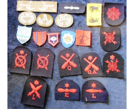 Collection of various cloth badges including Navy trade badges, Army proficiency badges and Formation flashes. 