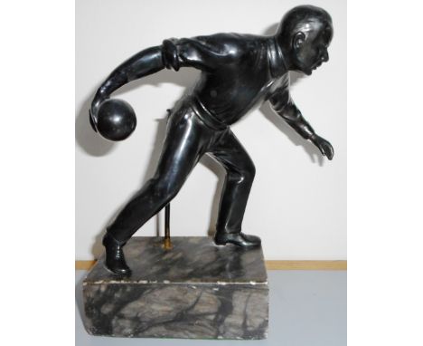 Interesting metal figure playing bowls. 17cm high, on plinth.