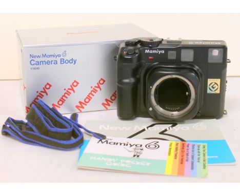 New Mamiya 6 camera body Y11010, serial no. 306850, boxed with instruction manual.