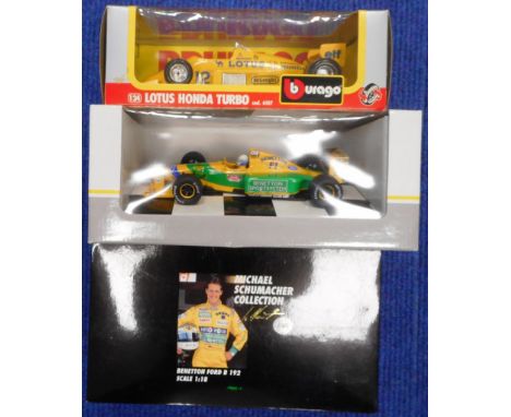 Three large scale racing cars. Boxed new.