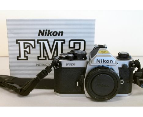 Nikon FM2 camera body, serial no. 7821971, with instruction manual.