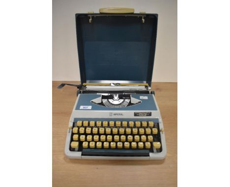 A vintage Imperial 202 typewriter with hard case and instruction manual.