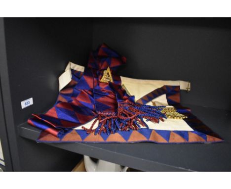 A Masonic kid leather apron with matching sash.