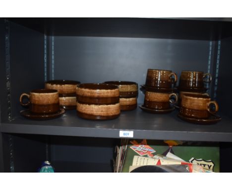 Six retro treacle glazed teacups and saucers and matching bowls
