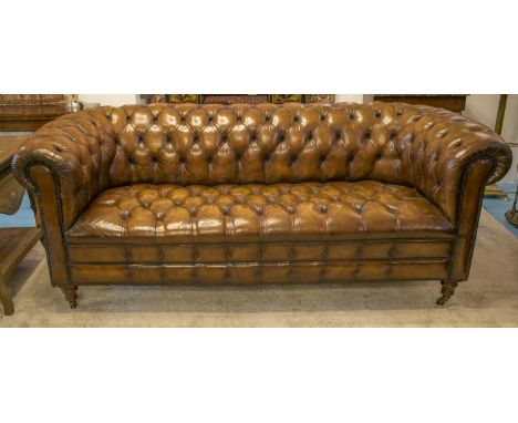 CHESTERFIELD SOFA, vintage hand finished and deep button upholstered leaf brown leather with carved back and arms, 220cm W.