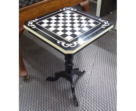 CHESS BOARD TABLE, ebonised, on a tripod base, 49cm x 49cm x 72cm H.