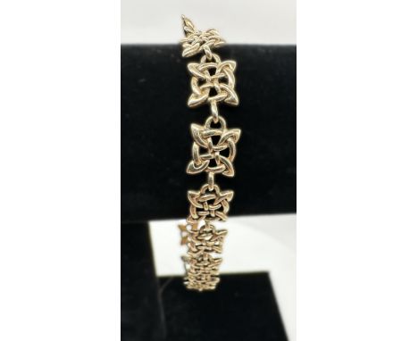 A celtic design 9ct yellow gold fancy bracelet, 7 + 1/2 inches long, approx weight 11.7 grams, in great condition