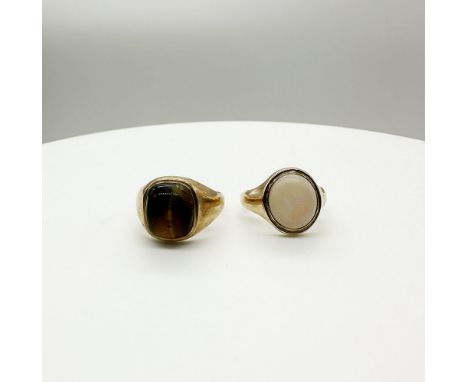 1 signet ring has a tigers eye stone and is a size T, 1 has an opal stone and is a size M+1/2, approx weight 11 grams