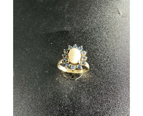 A 14ct yellow gold dress ring with an opal set stone Size M+1/2, approx weight 3.6 grams