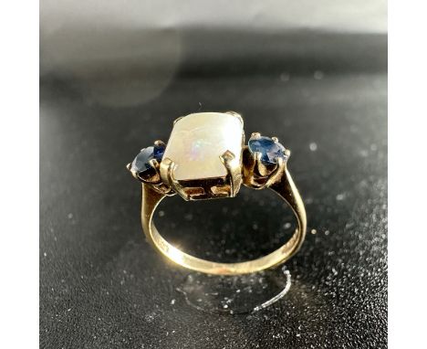 A 9ct yellow gold opal + sapphire dress ring, approx weight 2.1grams, size M