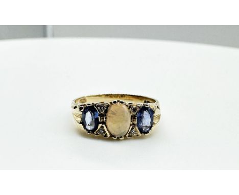 A 14ct yellow gold tanzanite and opal ring, stunning old style mount set in 585 American 14ct gold, ring maker CLM initials, 